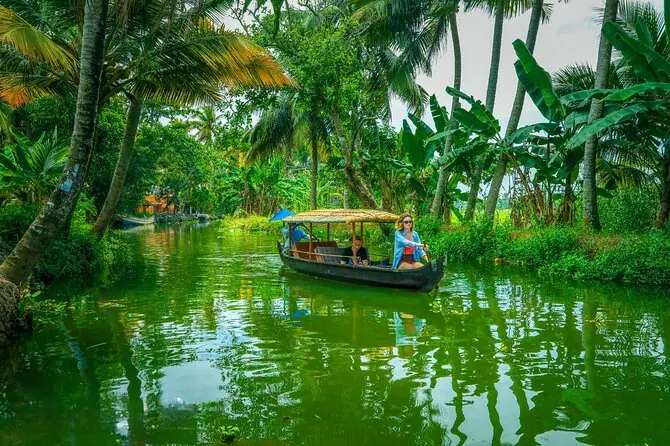 Country boat on a green Alleppey backwater