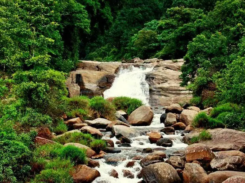 Chinnakallar falls flowing over boulders near Valparai