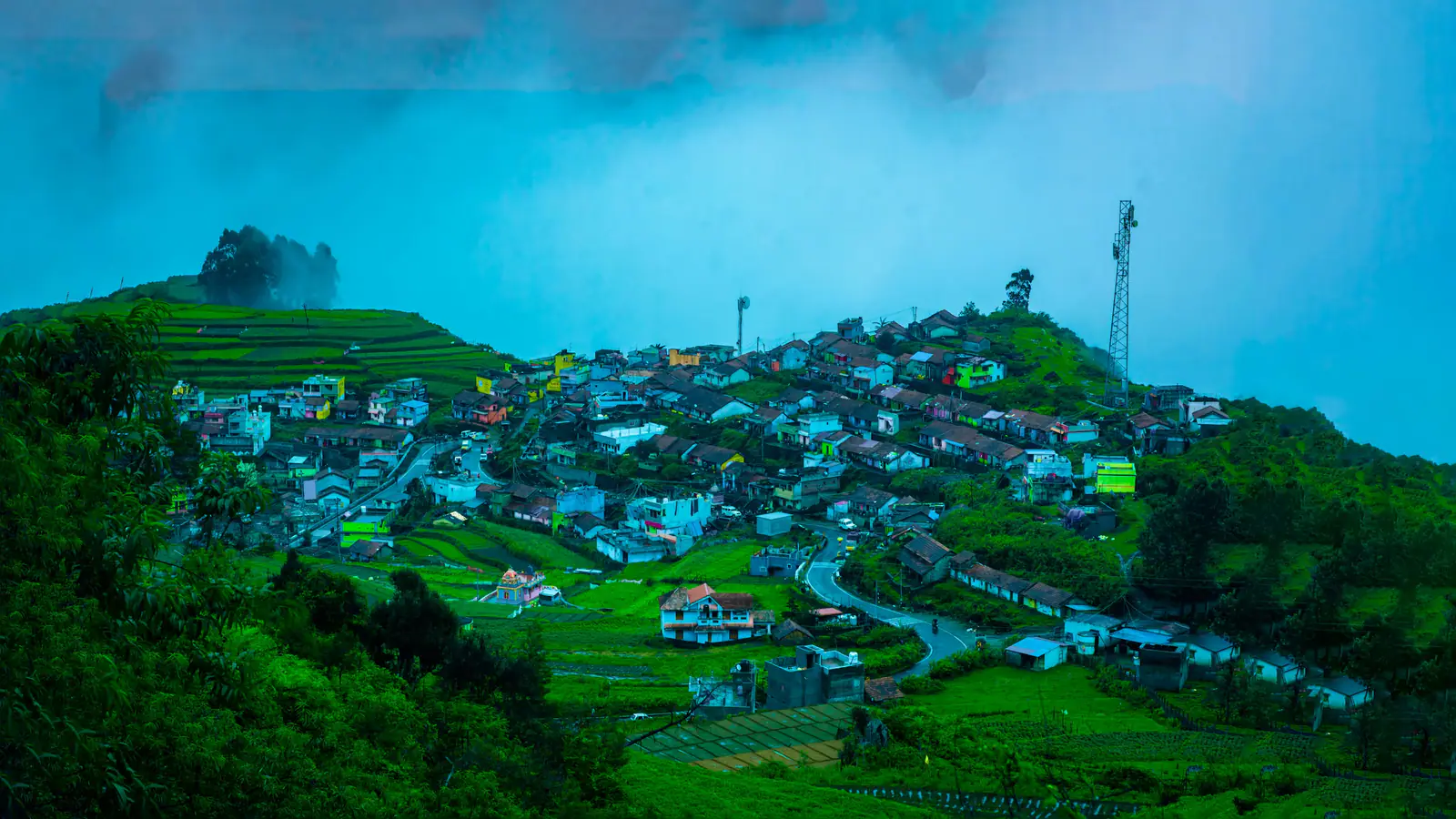 Hill town under a blue sky