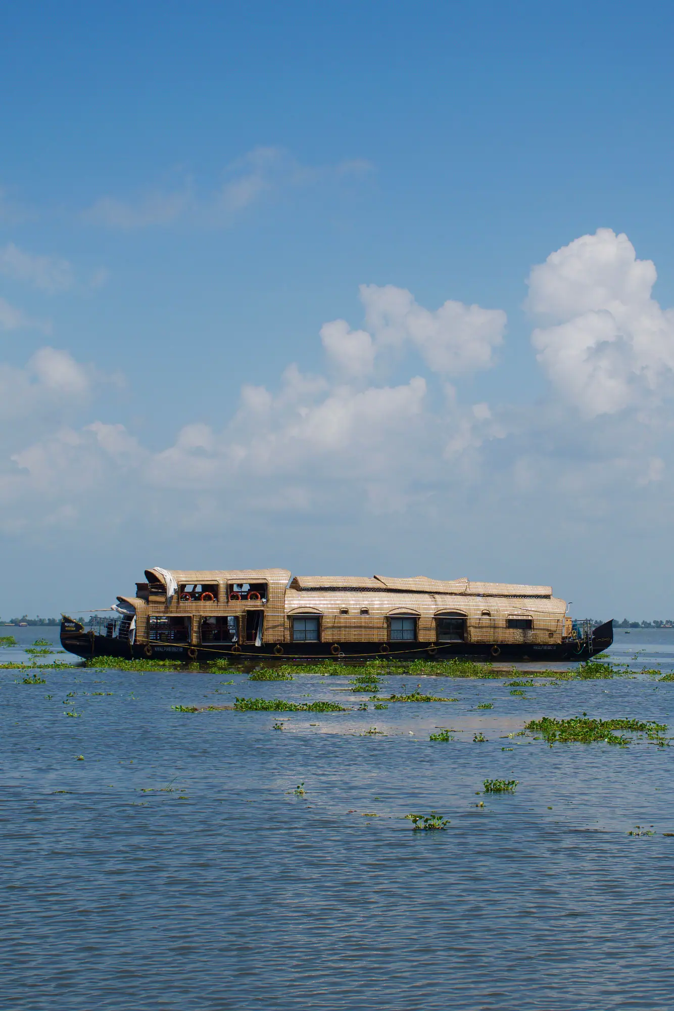Houseboat cruising on an open lake