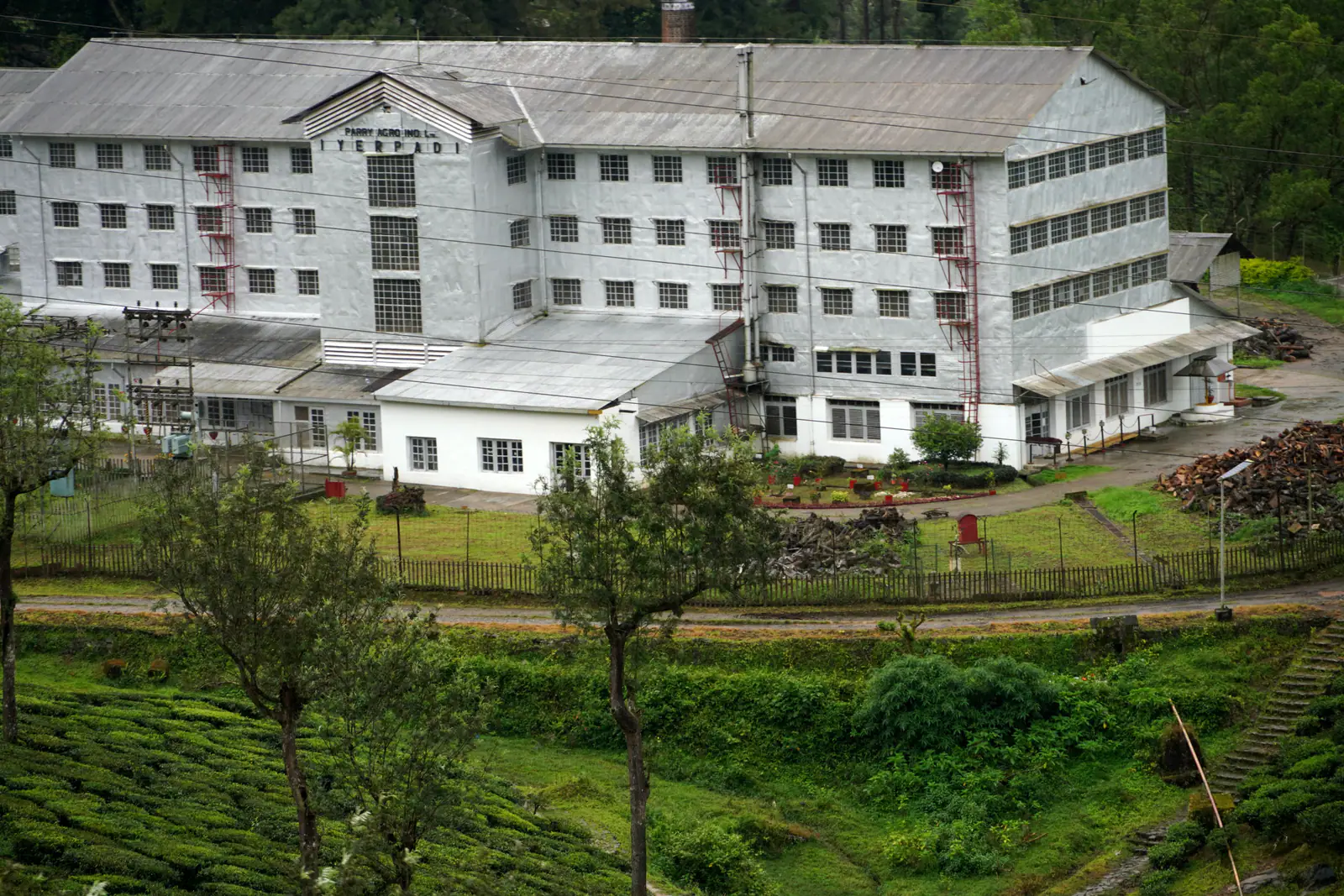 Tea factory surrounded by plantations in Valparai